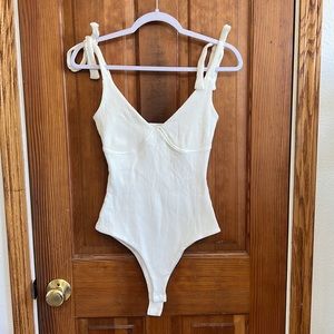 Body suit with shoulder ties. Excellent condition